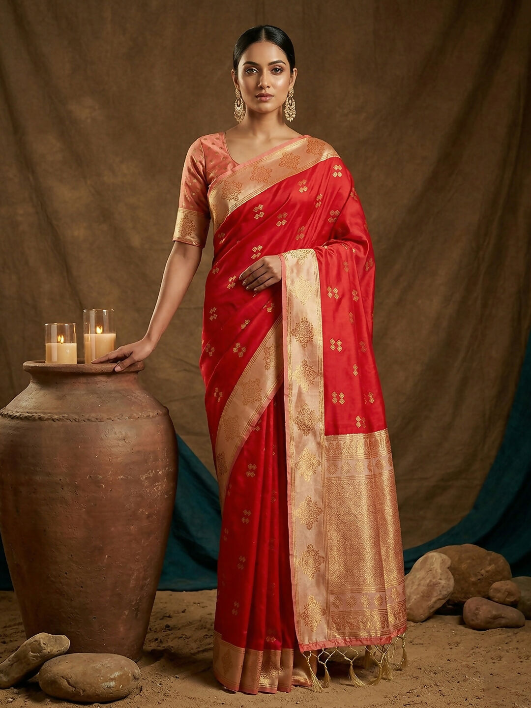 Elegant red soft silk saree with a contrast peach blouse for traditional occasions