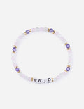 WWJD letter beaded bracelet featuring light purple and clear crystals with gold-tone accents on a white background
