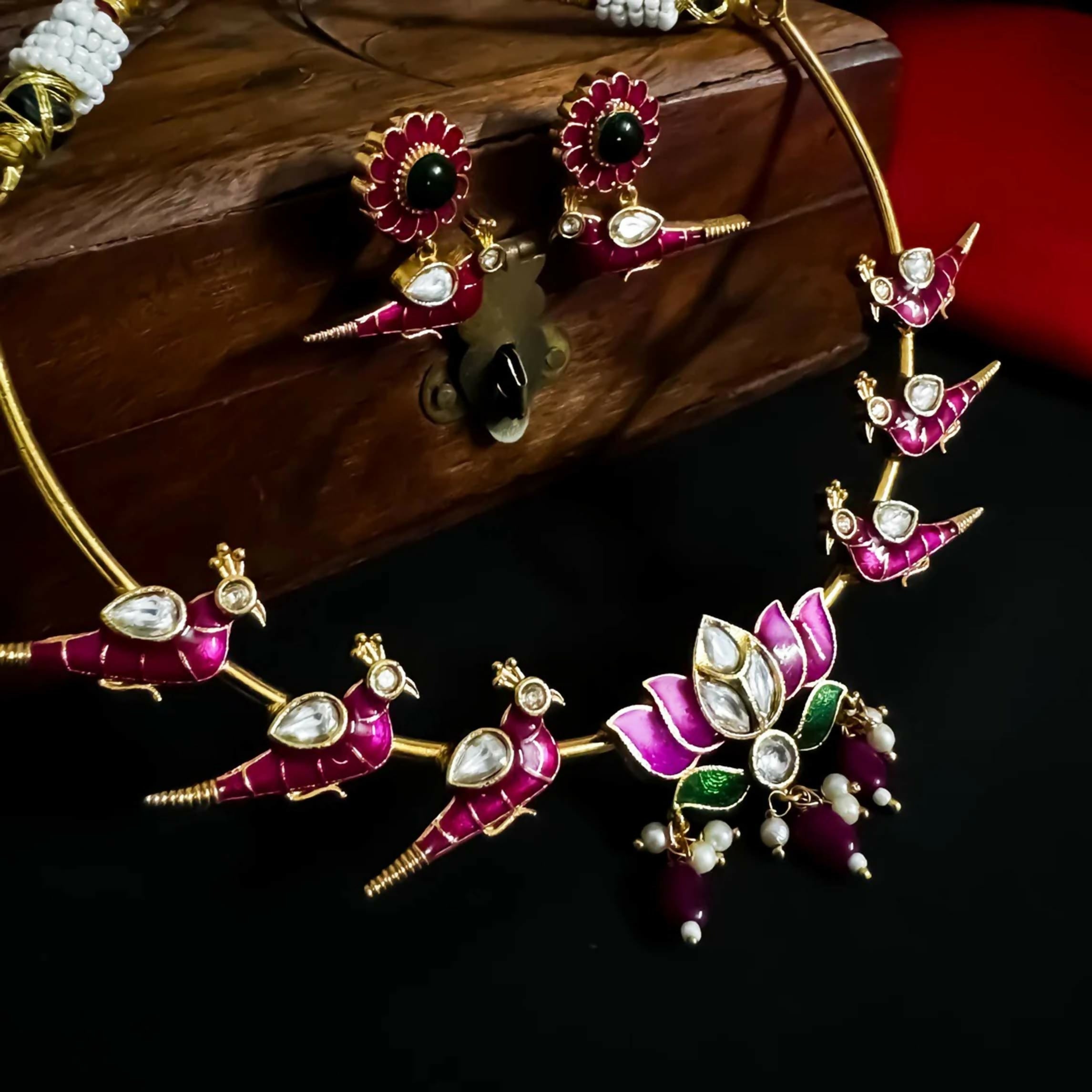 Pink brass Jadaau Hasli necklace with intricate peacock design