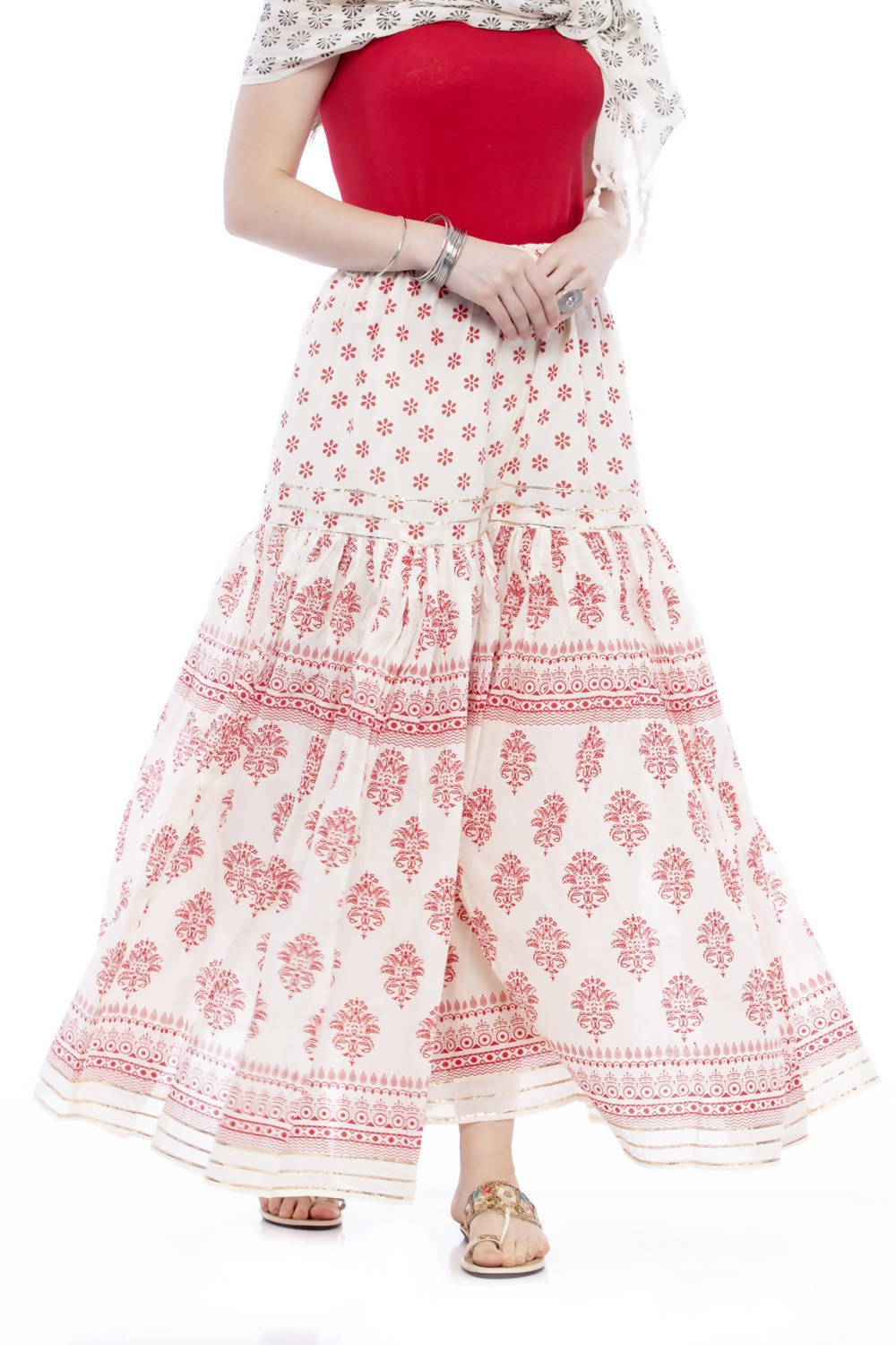 Off-white and red cotton block print palazzo pants with intricate lace work detailing.