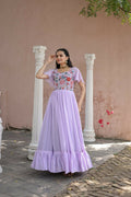 Woman wearing a floor-length purple faux georgette Anarkali dress with sequins and thread embroidery