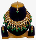Gold-plated Kundan necklace and earring set with traditional stone detailing