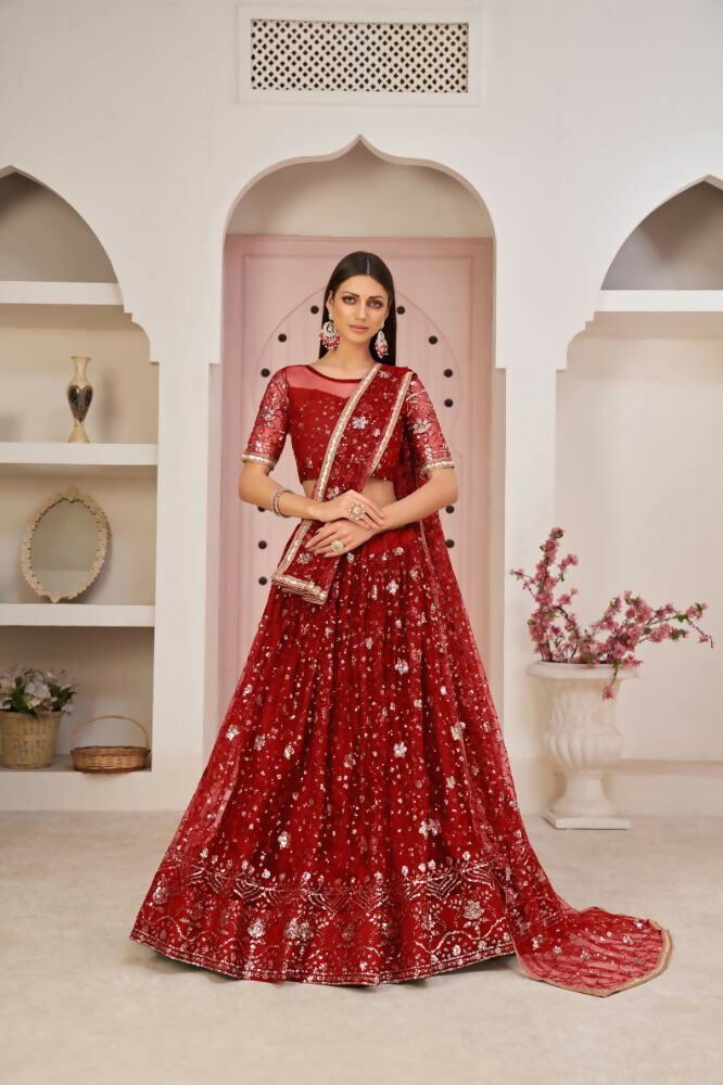 Red Butterfly Net Lehenga Choli with rich Zari and sequence embroidery for weddings.