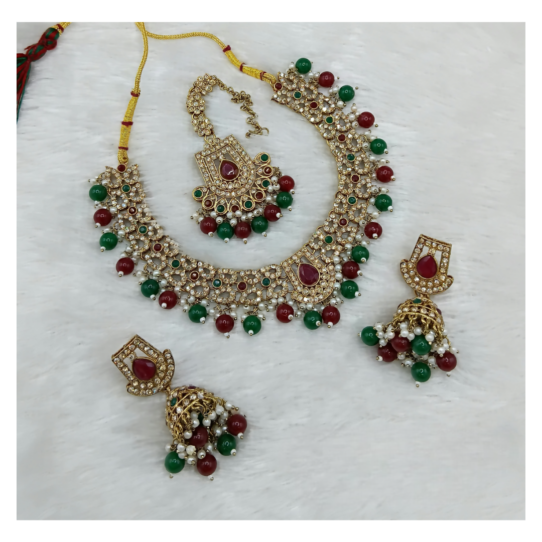 Exquisite maroon and green stone work necklace set by Dista for ethnic occasions