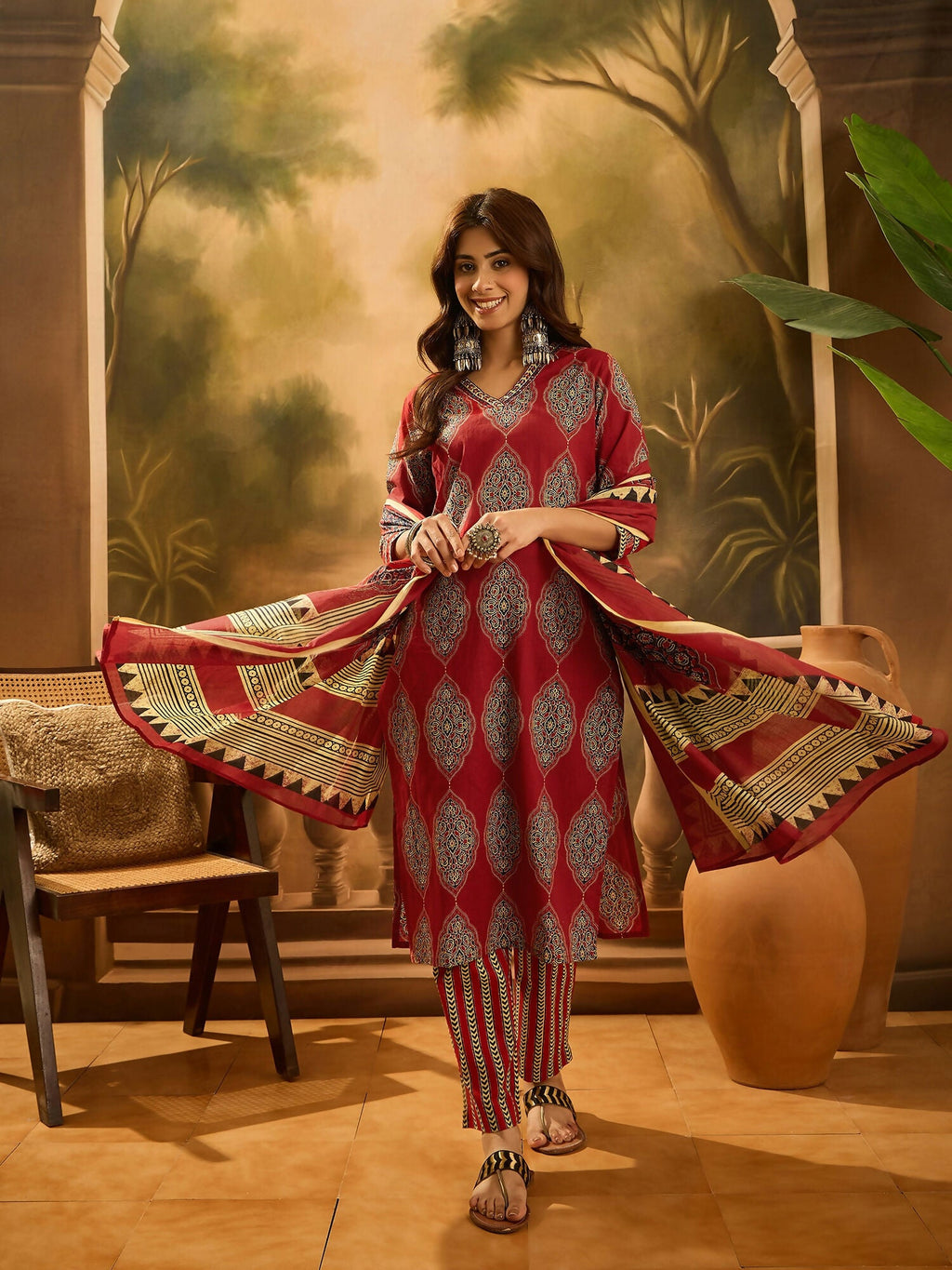 Close-up view of a maroon printed pure cotton kurta set with a classic ethnic aesthetic.