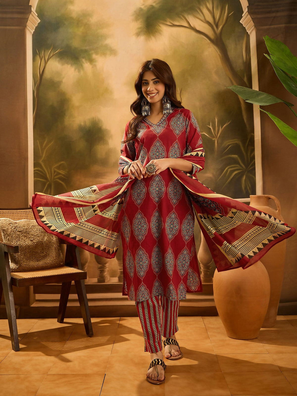 Close-up view of a maroon printed pure cotton kurta set with a classic ethnic aesthetic.