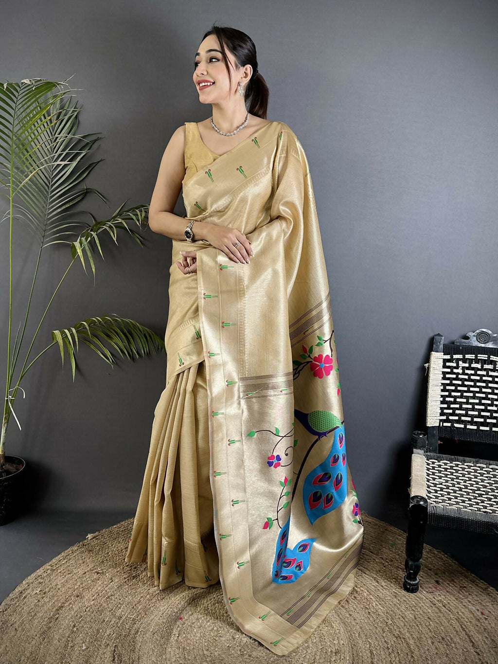 Elegant ivory tissue Paithani saree with peacock and floral motifs and matching off-white unstitched blouse