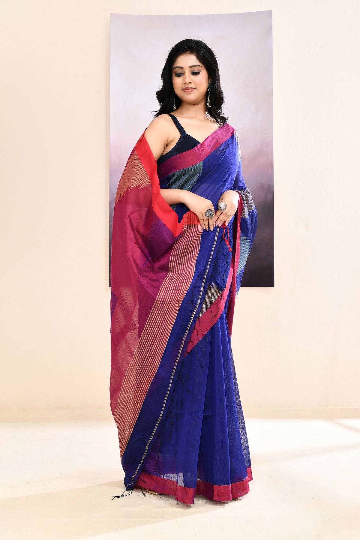Royal blue Jamdani saree with traditional temple border and intricate embellishments