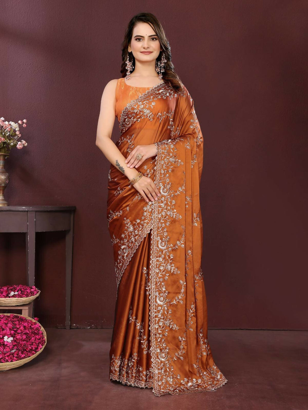 Elegant Copper Rangoli Silk Saree with silver embroidery and cutwork lace border, floor length.