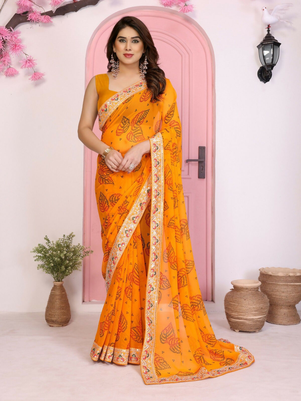 Yellow georgette saree featuring a traditional Rajwadi Bandhani print for party wear