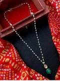 Handmade shell pearl chain necklace with an intricate Green Jade Kundan pendant on a gold-tone brass base.