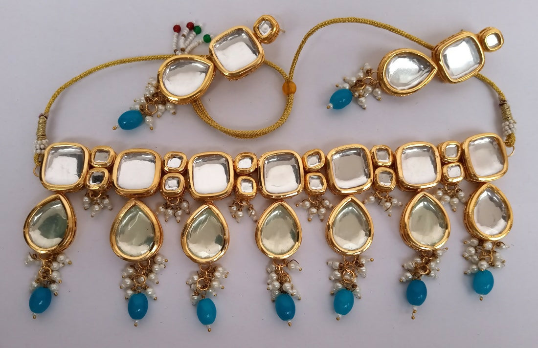 Elegant Firozi Kundan necklace set with gold plated finish and adjustable cord