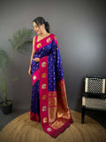 Elegant maroon butti Banarasi silk saree with traditional motifs and matching unstitched blouse fabric.
