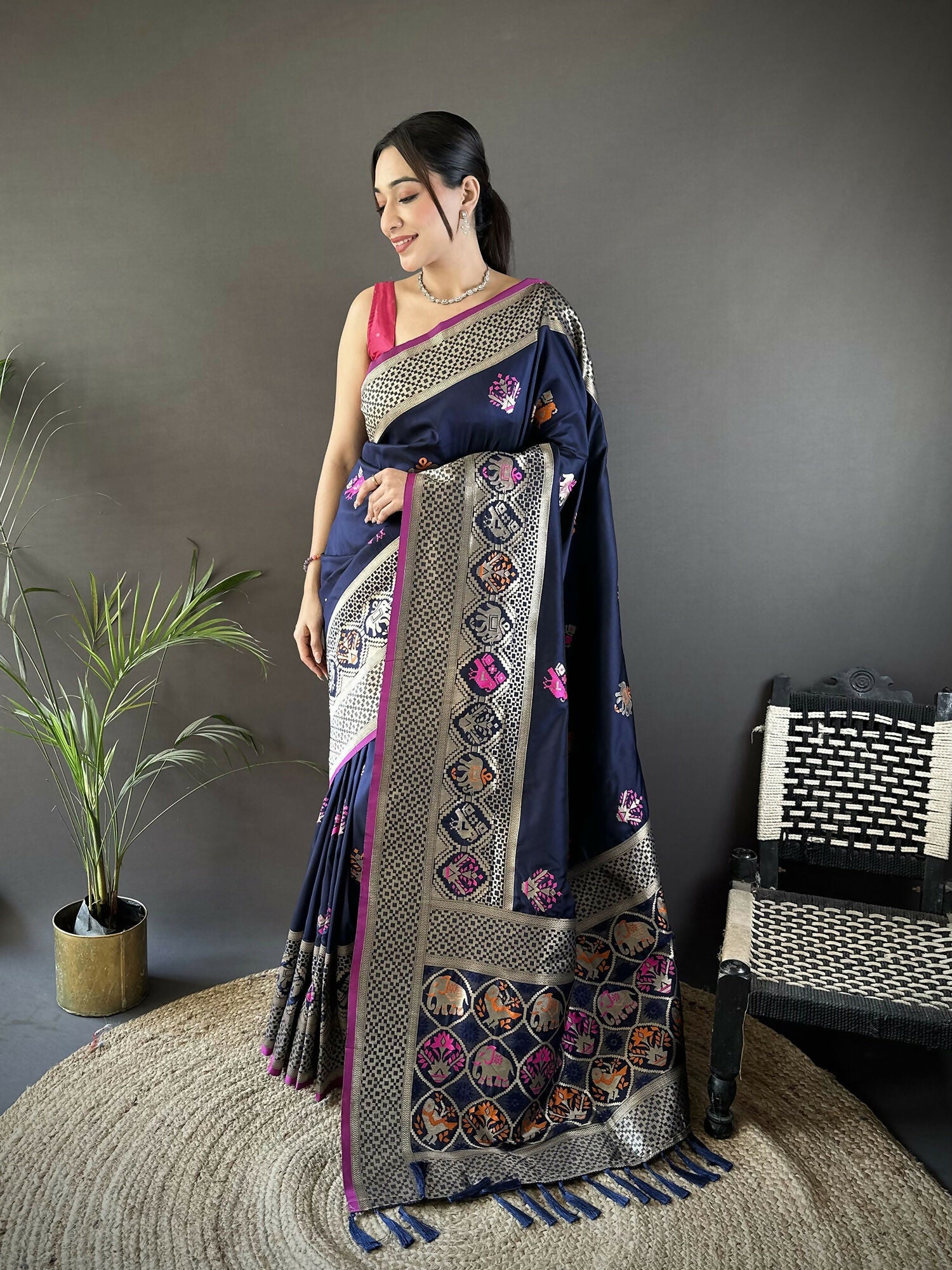 Navy blue Banarasi saree in soft lichi silk with elephant motifs and a pink blouse