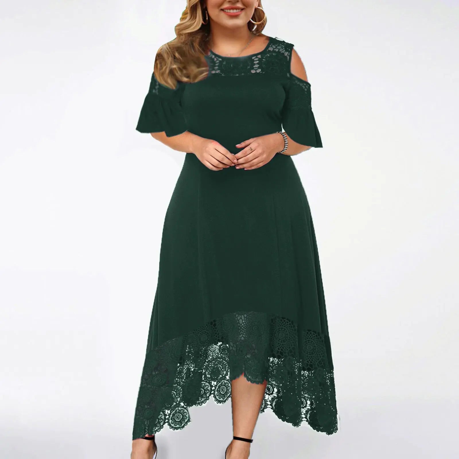 A woman wearing a stylish off-shoulder high-low dress with lace trim detailing on the shoulders and hem in a gradient color pattern.