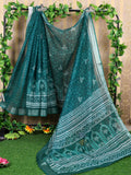 A elegant teal cotton saree with matching blouse, featuring a comfortable and breathable design.