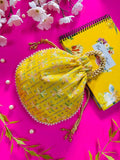 Vibrant yellow potli bag featuring intricate pearl hand work embroidery