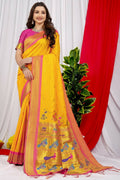 Vibrant yellow Paithani silk saree with Zari work and a magenta blouse