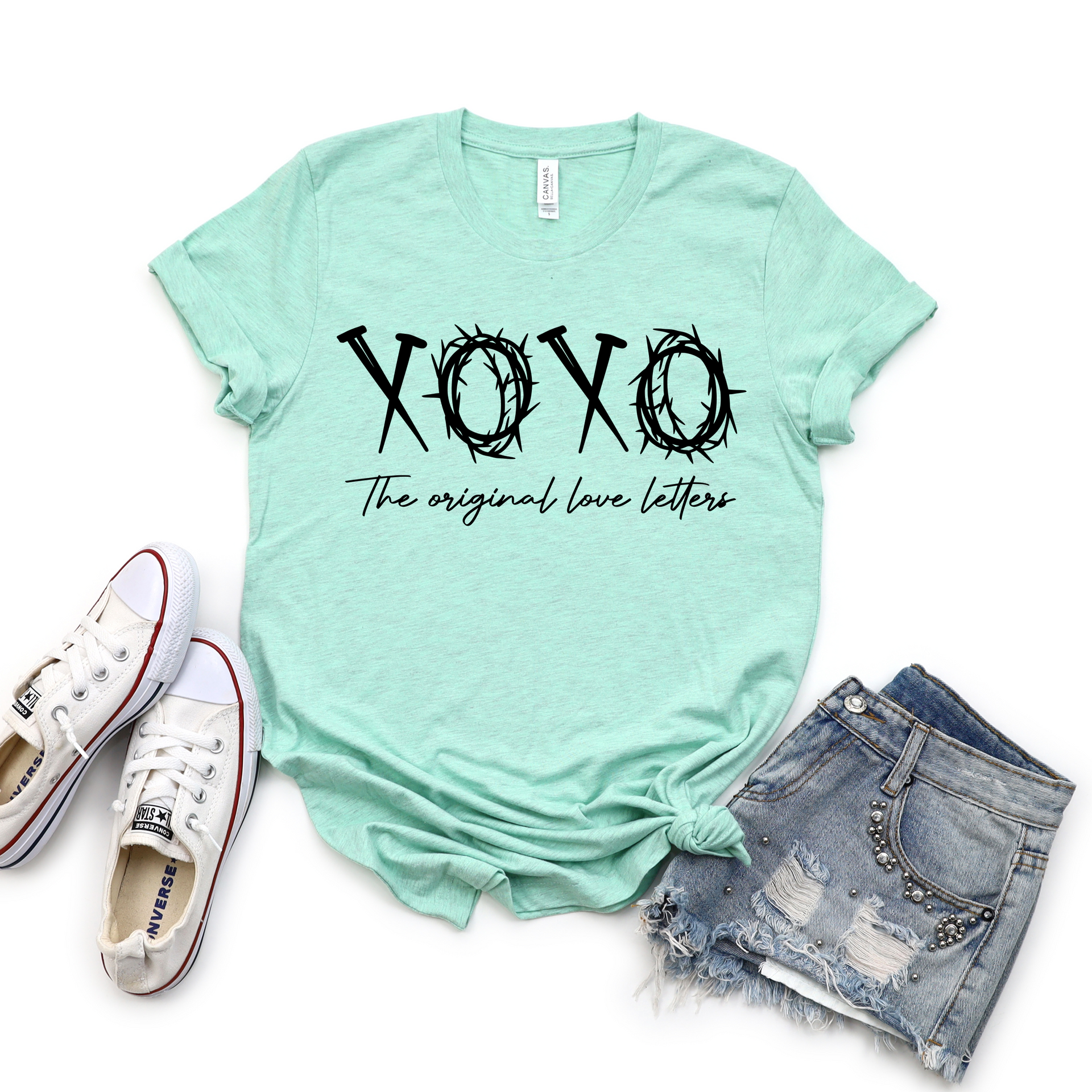 XOXO Original Love Letters graphic tee in heather prism mint color on a flat lay