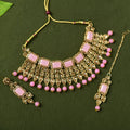 Elegant gold-polished brass choker in baby pink with kundan stones and sliding clasp