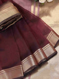 Elegant purple organza saree featuring a sheer texture and a matching blouse piece.