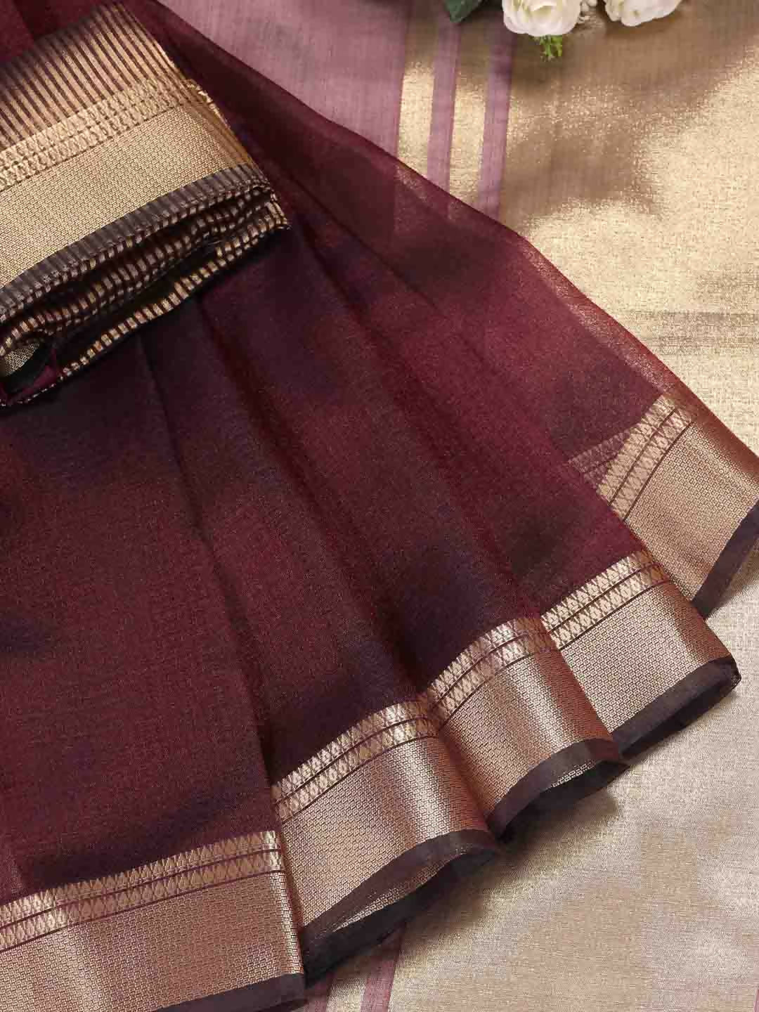 Elegant purple organza saree featuring a sheer texture and a matching blouse piece.