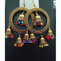 Traditional gold-polished jhumka earrings with pearl latkan detailing for weddings.