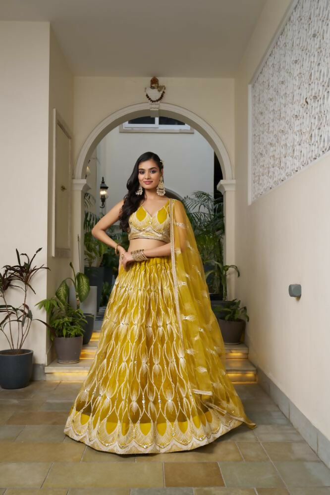 Mustard Yellow Butterfly Net Lehenga with white cotton thread and sequence embroidery