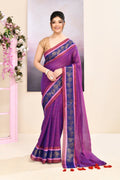 Purple cotton saree featuring an ornate golden Zari border and embellishments.