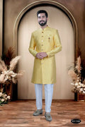 Yellow brocade indo-western kurta paired with white pyjamas for toddlers