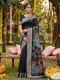A sophisticated black linen cotton saree with matching blouse piece draped elegantly.