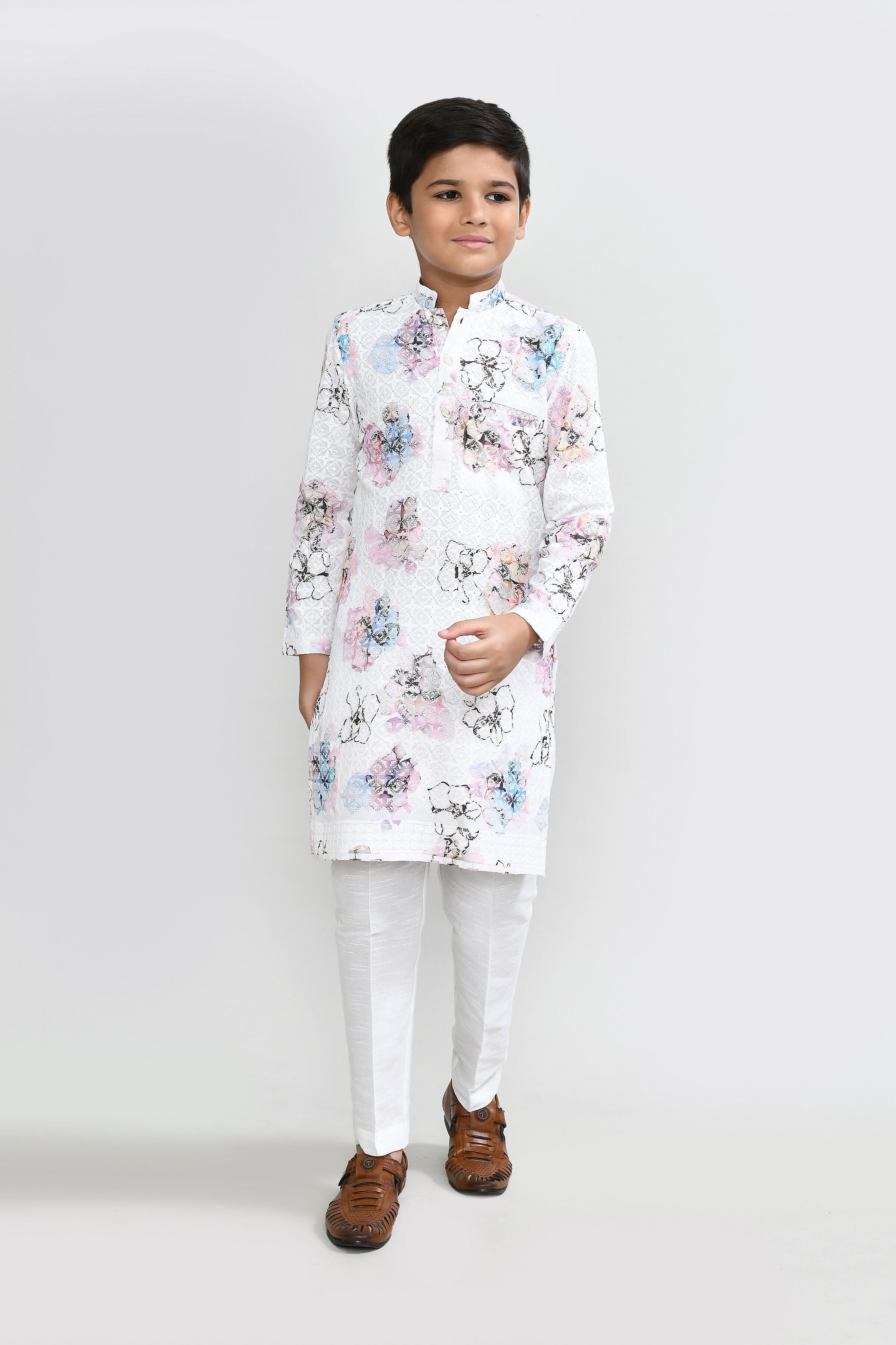 Classic white cotton kurta paired with art silk straight pants