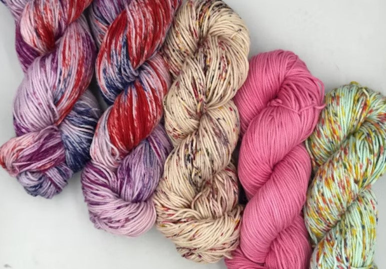 Skein of Malabrigo Verano 100% Pima Cotton yarn in vibrant hues