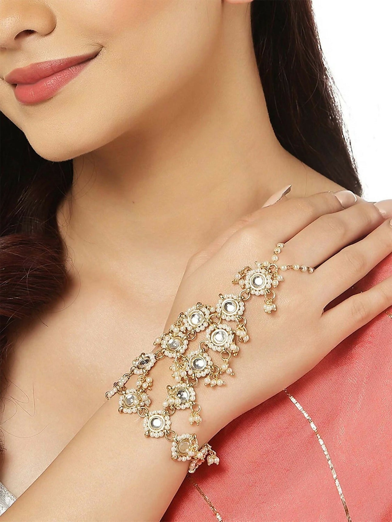 Pink Kundan stone Hathphool with gold polish finish on a neutral background
