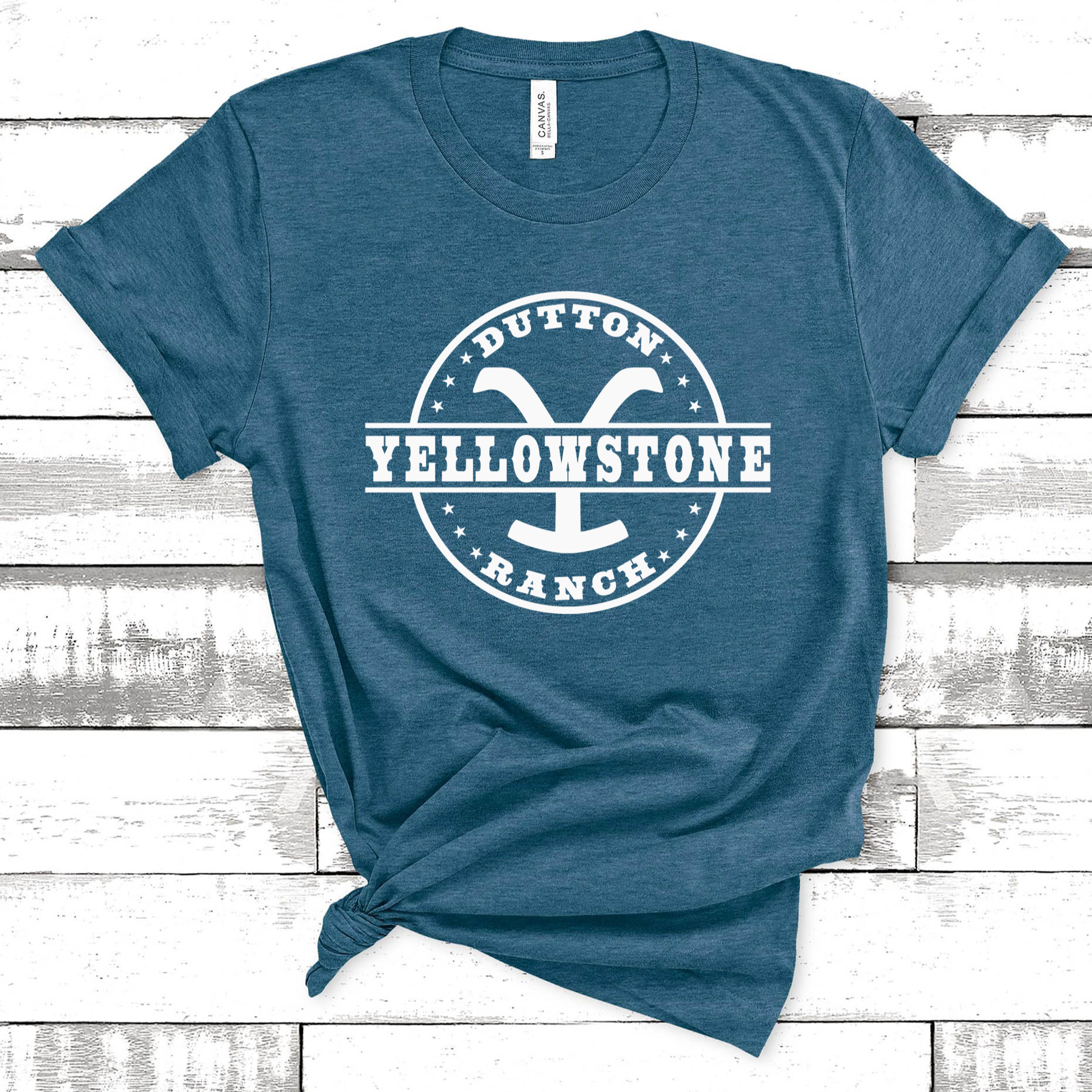 Heather teal unisex t-shirt with white Yellowstone Dutton Ranch logo text in a circle graphic