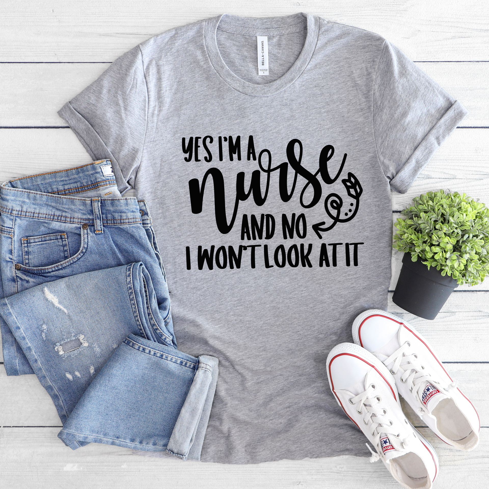 Athletic heather gray Bella Canvas graphic t-shirt with black lettering that reads Yes I'm A Nurse And No I Won't Look At It
