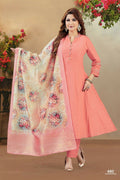 Peach colored soft silk kurta set featuring intricate embroidery details