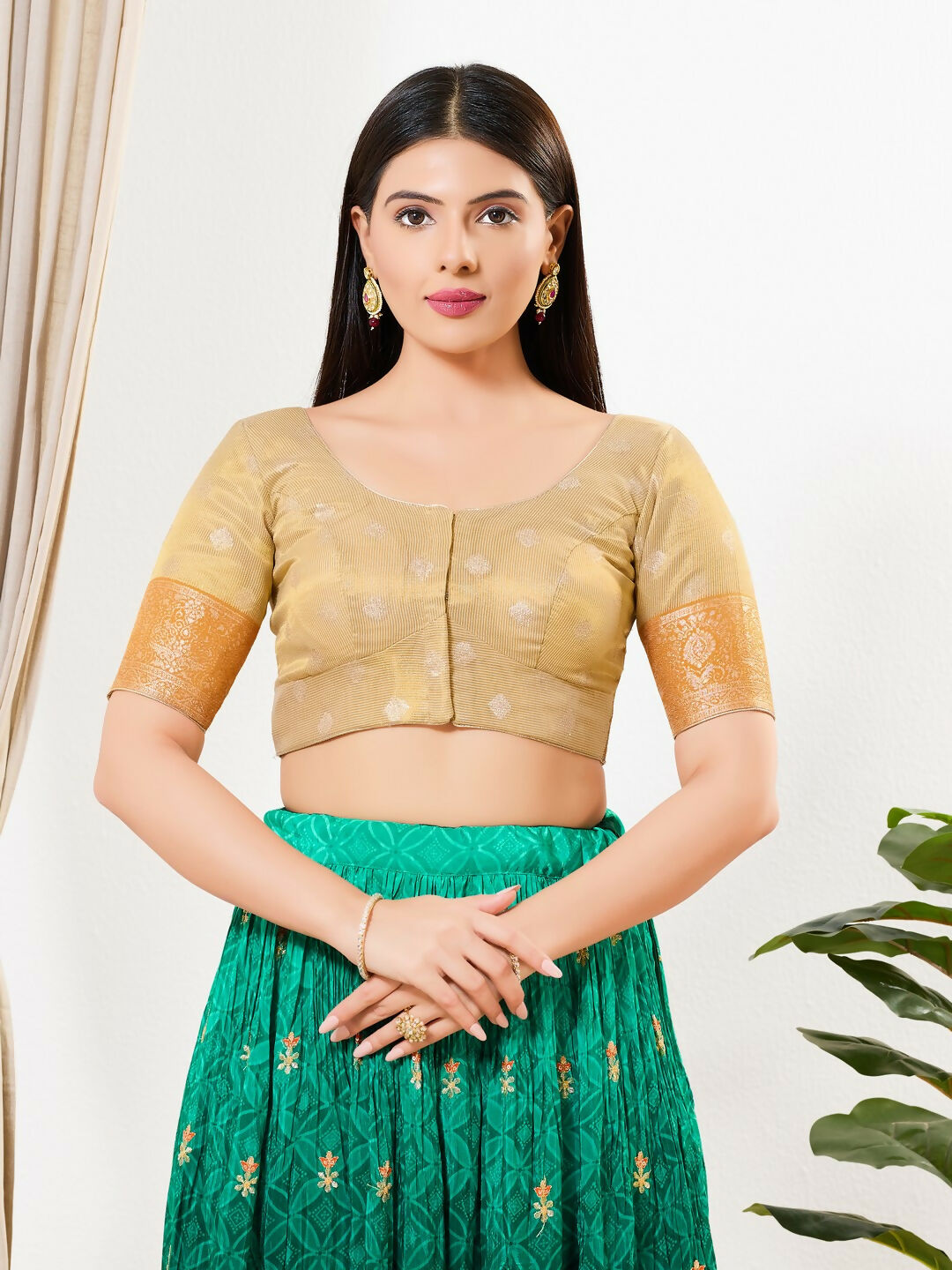 Gold tissue fabric blouse with elbow sleeves and a round neck