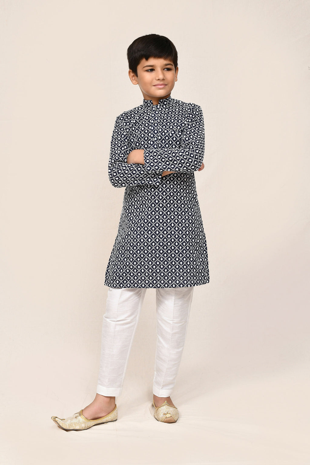 Navy blue cotton kurta worn with contrasting white straight fit trousers