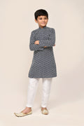 Navy blue cotton kurta worn with contrasting white straight fit trousers