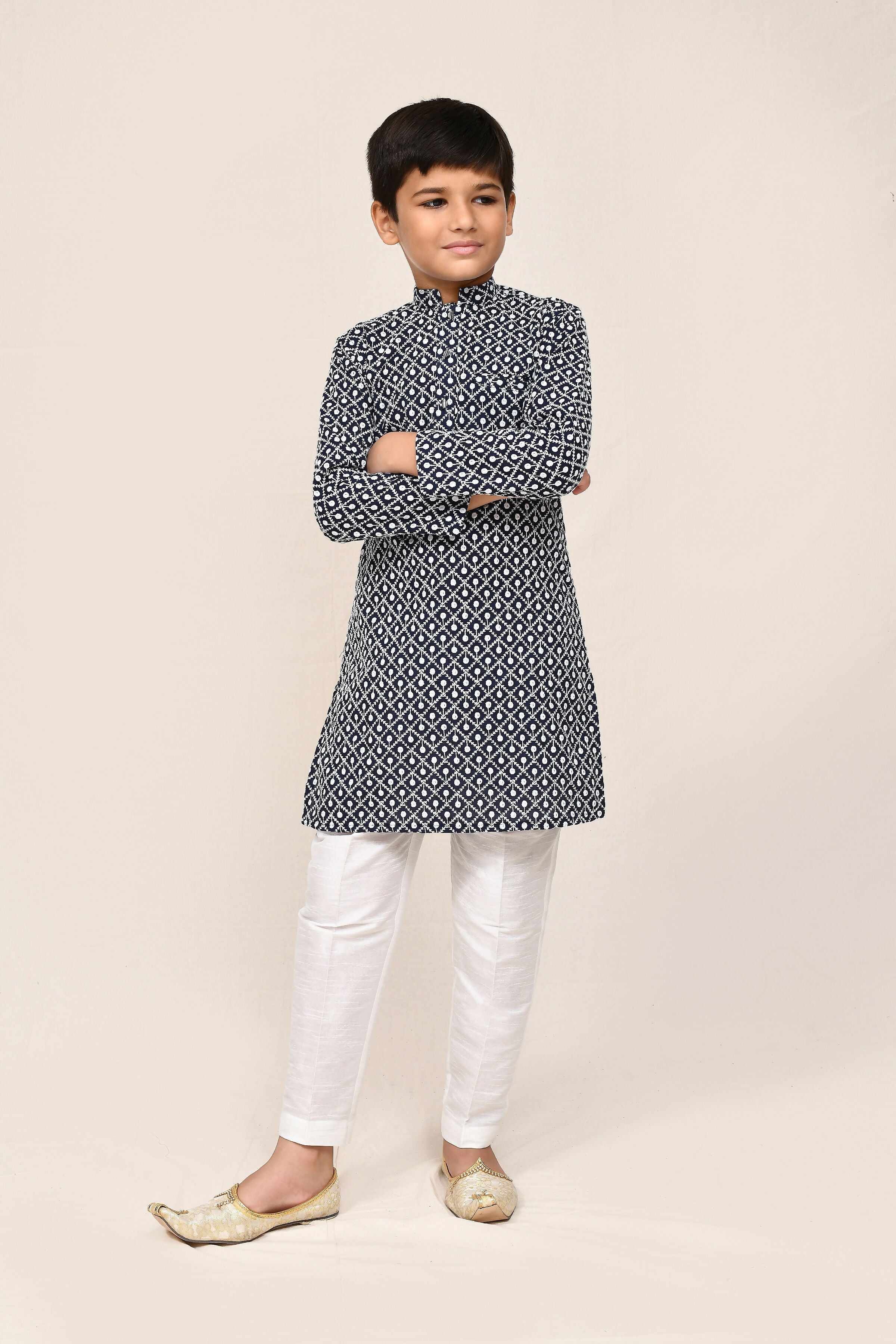 Navy blue cotton kurta worn with contrasting white straight fit trousers