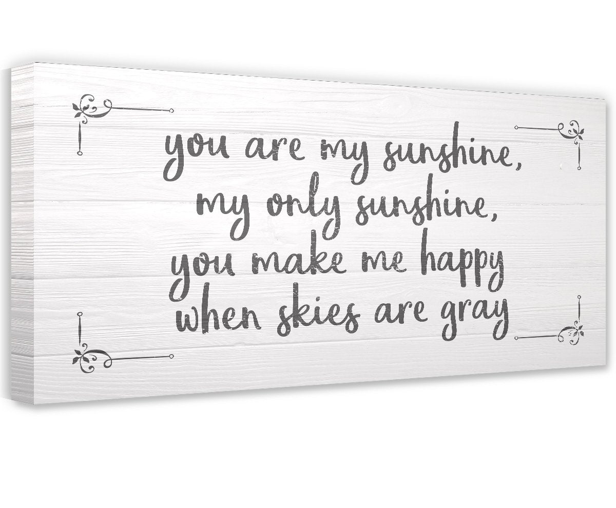 You Are My Sunshine canvas wall art in a nursery with white wood texture design.