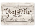 Rustic white wood-look metal sign featuring the quote You & Me WE GOT THIS with floral details