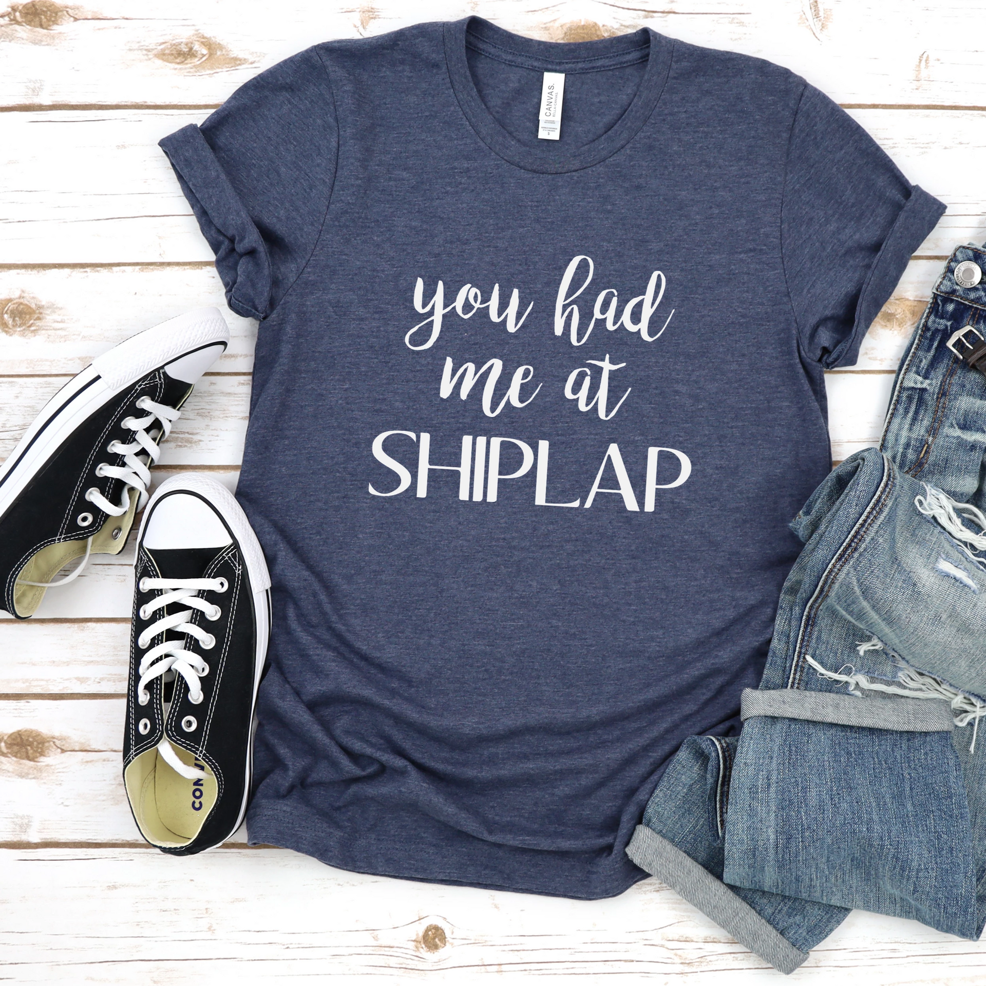 Heather navy unisex t-shirt with the text You Had Me At Shiplap in white print