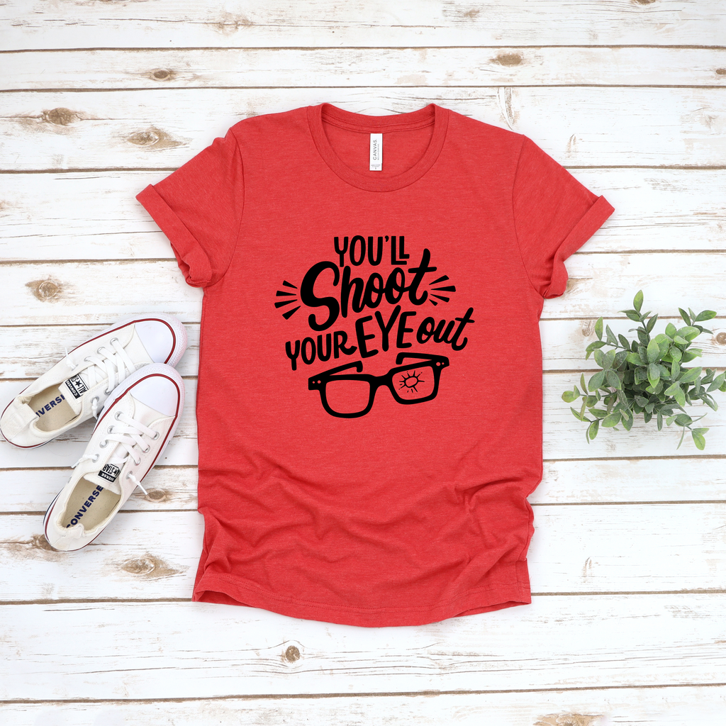 Heather red unisex t-shirt with black graphic text that reads You'll Shoot Your Eye Out and an illustration of glasses