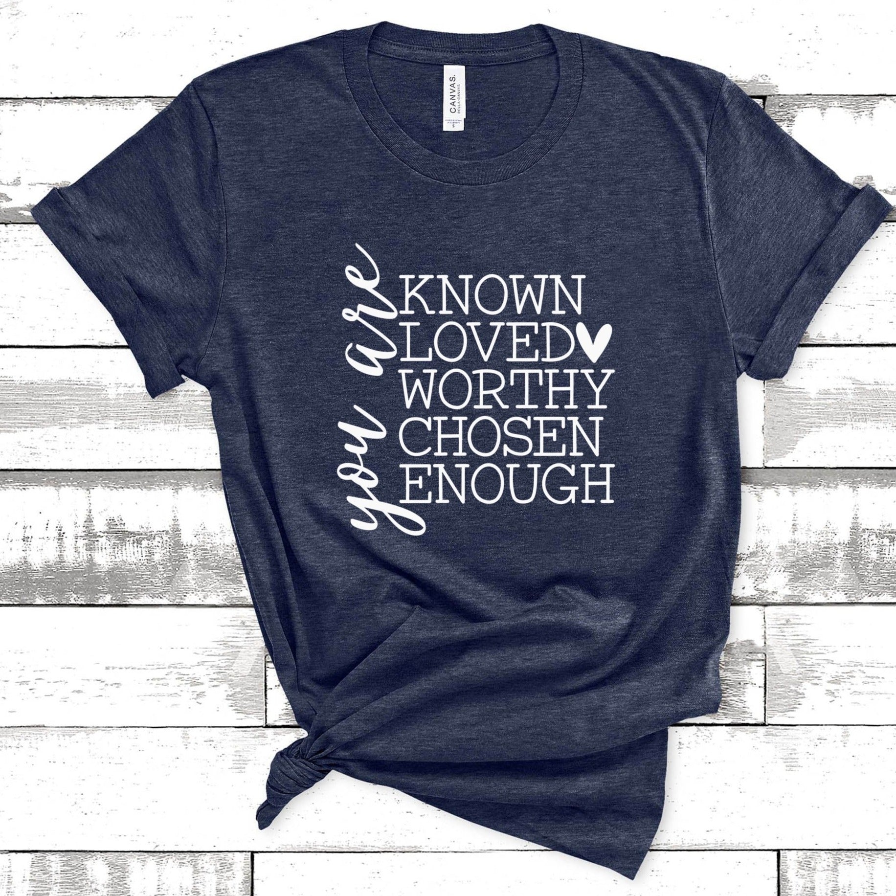 Heather navy Bella Canvas unisex t-shirt with white graphic text reading You Are Known Loved Worthy Chosen Enough