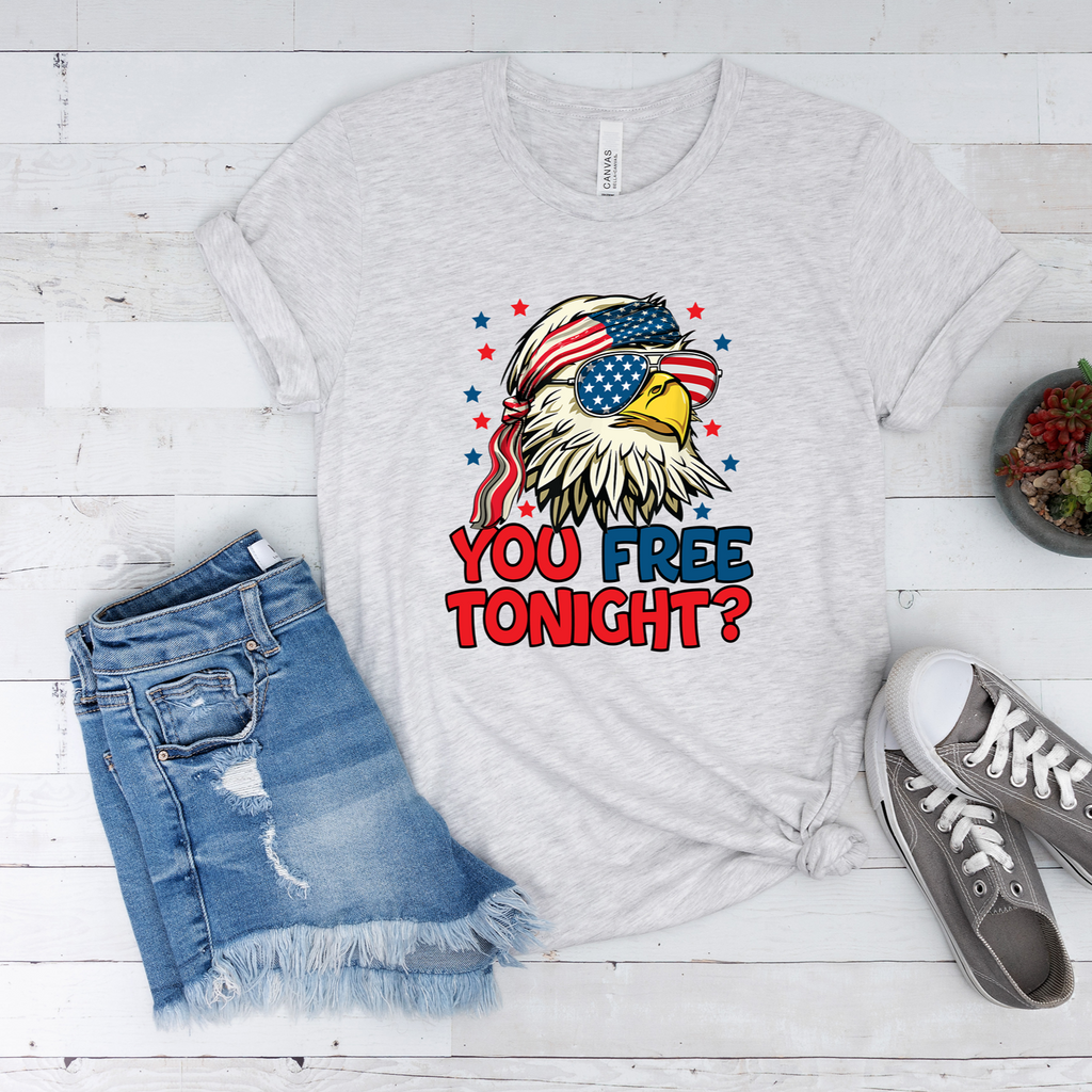 Ash colored unisex t-shirt with a colorful eagle design wearing flag-patterned sunglasses with the text You Free Tonight