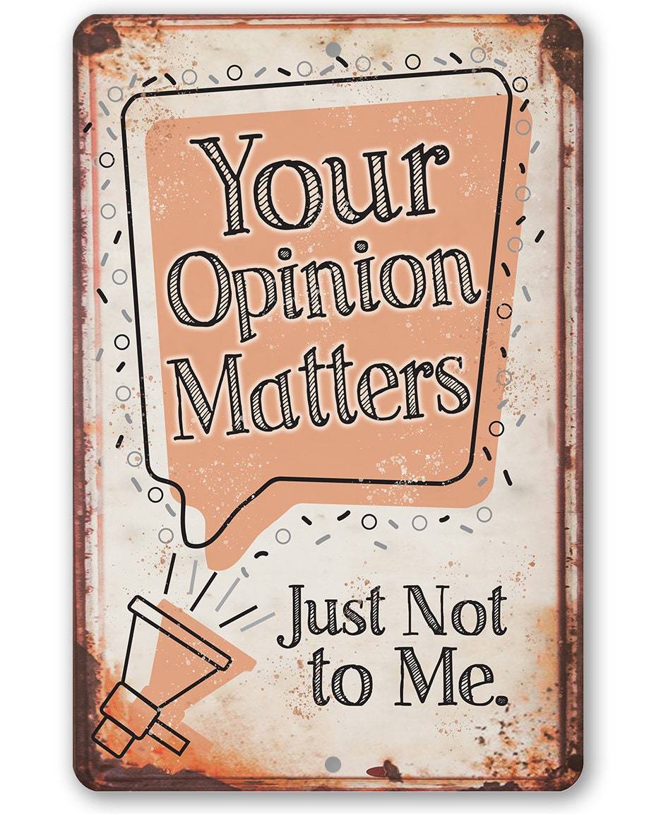 A rustic metal sign featuring the text Your Opinion Matters Just Not to Me with a megaphone graphic