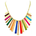 A traditional multicolor statement necklace with gold accents, styled for a bohemian maximalist look.