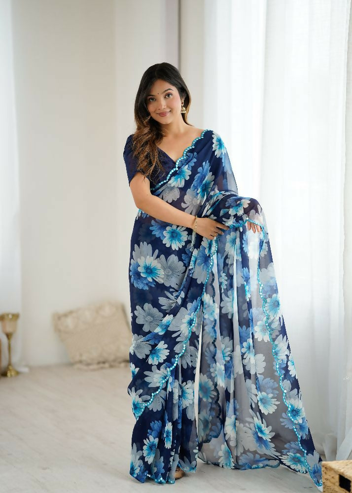 Elegant blue georgette saree with printed patterns and mirror work embellishments